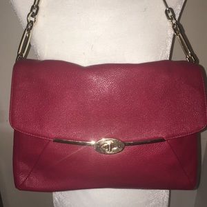 Red leather coach purse. Measures 13” wide by 10” high by 3” deep.